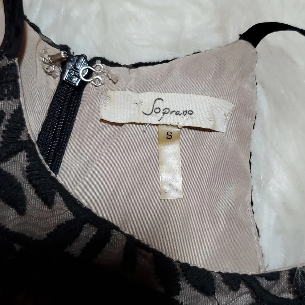 Soprano black with cream underlayer size small in like NEW condition